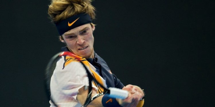 Andrey Rublev of Russia hits a return during his men's singles second round match against Fabio Fognini of Italy at the China Open tennis tournament in Beijing on October 4, 2018. (Photo by NICOLAS ASFOURI / AFP)