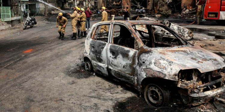 Fire fighters douse a fire at Gokul puri tyre market which was burnt Tuesday in New Delhi, India, Wednesday, Feb. 26, 2020. At least 20 people were killed in three days of clashes in New Delhi, with the death toll expected to rise as hospitals were overflowed with dozens of injured people, authorities said Wednesday. The clashes between Hindu mobs and Muslims protesting a contentious new citizenship law that fast-tracks naturalization for foreign-born religious minorities of all major faiths in South Asia except Islam escalated Tuesday. (AP Photo/Manish Swarup)