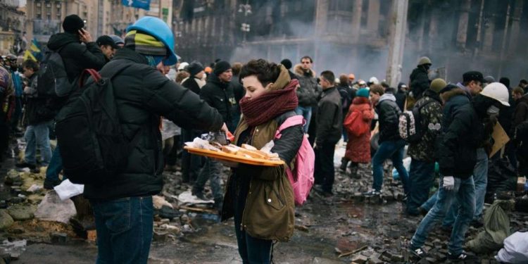 The occupation of Indipendence Square (Maidan Nezalezhnosti) continues. The police attacked during yesterday afternoon and at least 26 peoples died. President Yanukovich today tagged the occupiers as terrorist and the square is preparing for a major intervention by the police during the night. People who were living in, now burned, tents and building have been partially relocated to St. Michael Church which act also as a coordination for the firs aid. People have destroyed the cobblestone to make stones to thrown and built molotov cocktails to resist the comng night. LaPresseOnly Italy