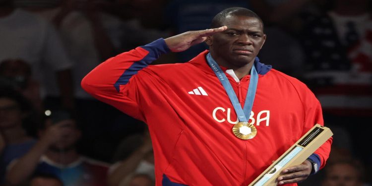 epa11531803 Gold medalist Mijain Lopez Nunez of Cuba celebrates during award ceremony for the Men Greco-Roman 130kg Wrestling competition in the Paris 2024 Olympic Games, at the South Paris Arena in Paris, France, 06 August 2024.  EPA/YAHYA ARHAB